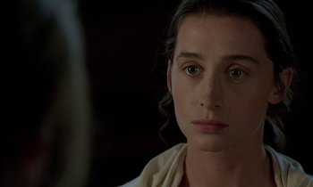 Movie still from “Tous les matins du monde” (1991), directed by Alain Corneau – A person wearing a white shirt; Close Up shot, Over the shoulder angle
