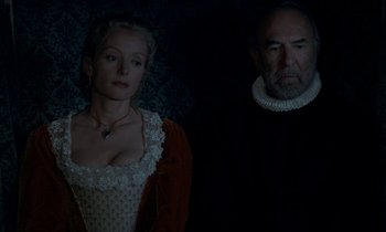 Movie still from “Tous les matins du monde” (1991), directed by Alain Corneau – A man and a woman standing next to each other; Medium shot, Overhead angle