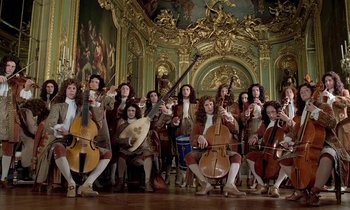 Movie still from “Tous les matins du monde” (1991), directed by Alain Corneau – A group of men in period costumes playing musical instruments; Wide shot, Low angle