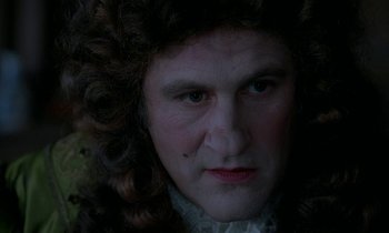 Movie still from “Tous les matins du monde” (1991), directed by Alain Corneau – A person wearing a wig; Close Up shot, Over the shoulder angle