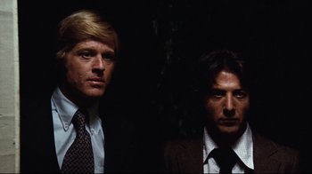 Movie still from “All the President's Men” (1976), directed by Alan J. Pakula – A couple of men standing next to each other in the dark; Close Up shot, Low angle
