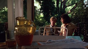 Movie still from “All the President's Men” (1976), directed by Alan J. Pakula – Two men are sitting at a table talking; Medium shot, Over the shoulder angle