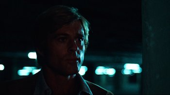 Movie still from “All the President's Men” (1976), directed by Alan J. Pakula – A person wearing a white shirt; Close Up shot, Low angle