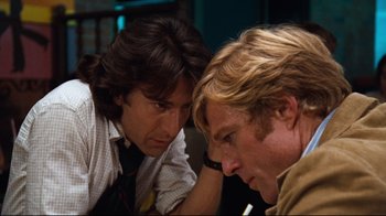 Movie still from “All the President's Men” (1976), directed by Alan J. Pakula – Two men looking at each other in a room; Close Up shot, Low angle