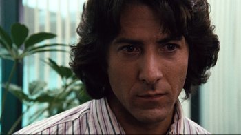 Movie still from “All the President's Men” (1976), directed by Alan J. Pakula – A person with long hair; Close Up shot, Low angle