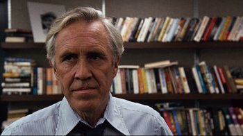 Movie still from “All the President's Men” (1976), directed by Alan J. Pakula – An older man in front of a book shelf; Close Up shot, Low angle