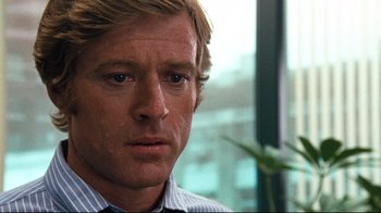 Movie still from “All the President's Men” (1976), directed by Alan J. Pakula – A person wearing a shirt and tie; Close Up shot, Over the shoulder angle