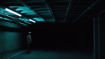 Movie still from “All the President's Men” (1976), directed by Alan J. Pakula – A man standing in an empty room at night; Extreme Wide shot, High angle