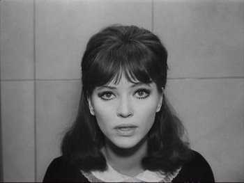 Movie still from “Alphaville” (1965), directed by Jean-Luc Godard – A black - and - white photo of a woman's face; Close Up shot, High angle