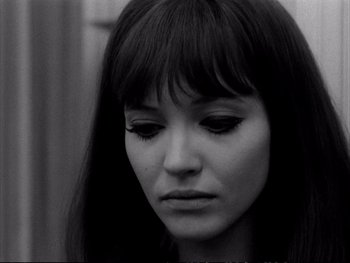Movie still from “Alphaville” (1965), directed by Jean-Luc Godard – A black and white photo of a woman's face; Close Up shot, High angle