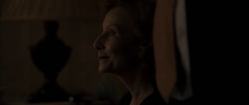 Movie still from “Alps” (2011), directed by Yorgos Lanthimos – An older woman is looking into the distance; Close Up shot, Over the shoulder angle