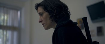 Movie still from “Alps” (2011), directed by Yorgos Lanthimos – A woman with long hair is looking to the side; Close Up shot, Low angle
