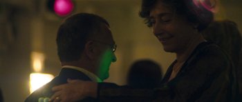 Movie still from “Alps” (2011), directed by Yorgos Lanthimos – A man and a woman are dancing in a room; Close Up shot, Over the shoulder angle