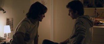 Movie still from “Alps” (2011), directed by Yorgos Lanthimos – A couple of people that are talking to each other; Medium shot, Over the shoulder angle
