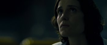 Movie still from “Alps” (2011), directed by Yorgos Lanthimos – A woman's face in the dark; Close Up shot, Low angle