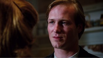 Movie still from “Altered States” (1980), directed by Ken Russell – A person wearing a suit and tie; Close Up shot, Low angle