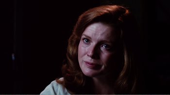 Movie still from “Altered States” (1980), directed by Ken Russell – A person with long red hair; Close Up shot, Over the shoulder angle