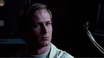 Movie still from “Altered States” (1980), directed by Ken Russell – A person wearing a white shirt; Close Up shot, Low angle