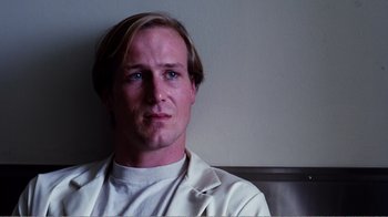 Movie still from “Altered States” (1980), directed by Ken Russell – A person wearing a white shirt; Close Up shot, Low angle