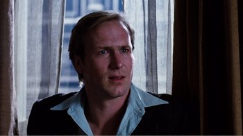 Movie still from “Altered States” (1980), directed by Ken Russell – A person wearing a shirt and jacket; Close Up shot, Over the shoulder angle