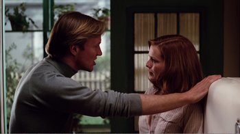 Movie still from “Altered States” (1980), directed by Ken Russell – A man and a woman standing next to each other; Medium shot, Over the shoulder angle