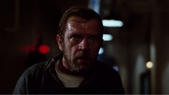 Movie still from “Altered States” (1980), directed by Ken Russell – A person wearing a jacket; Close Up shot, Low angle