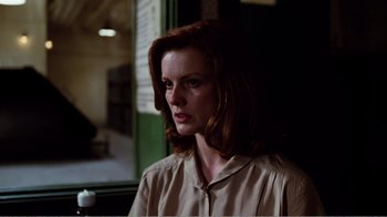 Movie still from “Altered States” (1980), directed by Ken Russell – A woman with red hair is looking at the camera; Close Up shot, Low angle