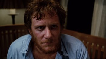 Movie still from “Altered States” (1980), directed by Ken Russell – A person wearing a shirt; Close Up shot, Low angle