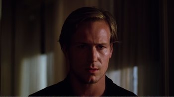 Movie still from “Altered States” (1980), directed by Ken Russell – A person wearing a black shirt; Close Up shot, Low angle