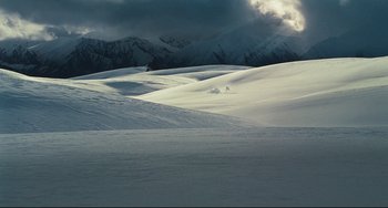 Movie still from “Alvin and the Chipmunks: The Squeakquel” (2009), directed by Betty Thomas – A view of a snow covered field with mountains in the background; Extreme Wide shot, High angle