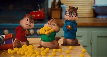 Movie still from “Alvin and the Chipmunks: The Squeakquel” (2009), directed by Betty Thomas – A group of chipmunks sitting on top of a wooden table; Medium shot, Low angle