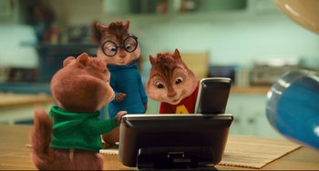Movie still from “Alvin and the Chipmunks: The Squeakquel” (2009), directed by Betty Thomas – A group of chipmunks sitting next to each other on top of a table; Medium shot, High angle