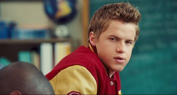 Movie still from “Alvin and the Chipmunks: The Squeakquel” (2009), directed by Betty Thomas – A young man in a red and yellow jacket; Close Up shot, Over the shoulder angle