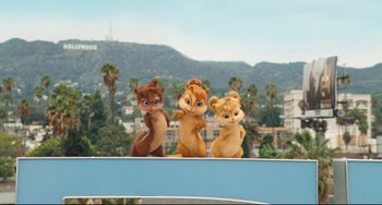 Movie still from “Alvin and the Chipmunks: The Squeakquel” (2009), directed by Betty Thomas – A group of stuffed animals sitting next to each other on top of a building; Wide shot, Low angle