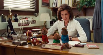 Movie still from “Alvin and the Chipmunks: The Squeakquel” (2009), directed by Betty Thomas – A woman sitting at a desk with stuffed animals; Medium shot, Over the shoulder angle
