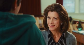 Movie still from “Alvin and the Chipmunks: The Squeakquel” (2009), directed by Betty Thomas – A person sitting in front of another person; Close Up shot, Over the shoulder angle