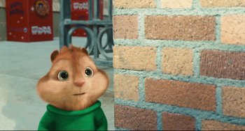 Movie still from “Alvin and the Chipmunks: The Squeakquel” (2009), directed by Betty Thomas – A stuffed animal next to a brick wall; Medium shot, Over the shoulder angle
