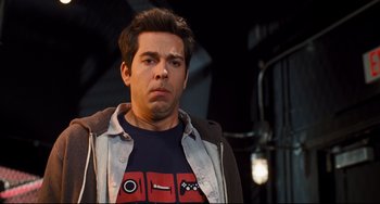 Movie still from “Alvin and the Chipmunks: The Squeakquel” (2009), directed by Betty Thomas – A young man with his hands on his chest; Close Up shot, Over the shoulder angle