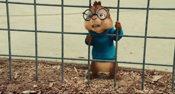 Movie still from “Alvin and the Chipmunks: The Squeakquel” (2009), directed by Betty Thomas – A chipmunk wearing a blue sweater and glasses; Medium shot, High angle