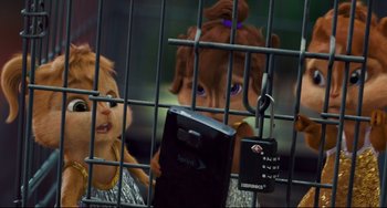 Movie still from “Alvin and the Chipmunks: The Squeakquel” (2009), directed by Betty Thomas – A couple of people that are behind a cage; Medium shot, Over the shoulder angle