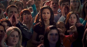 Movie still from “Alvin and the Chipmunks: The Squeakquel” (2009), directed by Betty Thomas – A group of people that are standing in a room; Medium shot, High angle