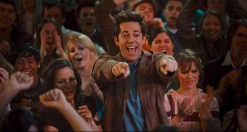 Movie still from “Alvin and the Chipmunks: The Squeakquel” (2009), directed by Betty Thomas – A group of young men and women in a crowd; Medium shot, Over the shoulder angle