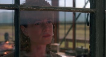 Movie still from “Always” (1989), directed by Steven Spielberg – A woman looking out of a window at a field; Close Up shot, Low angle