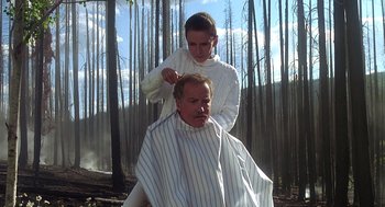Movie still from “Always” (1989), directed by Steven Spielberg – A man getting his hair combed by a woman; Medium shot, Low angle