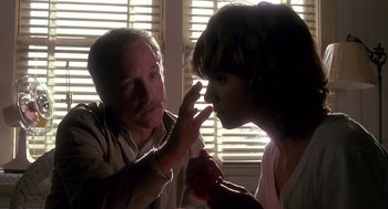 Movie still from “Always” (1989), directed by Steven Spielberg – An older man and a young woman looking at each other; Close Up shot, Low angle