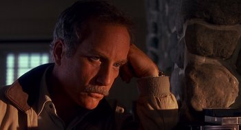 Movie still from “Always” (1989), directed by Steven Spielberg – A person with a beard and mustache; Close Up shot, Low angle