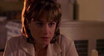 Movie still from “Always” (1989), directed by Steven Spielberg – A person sitting in a room; Close Up shot, Over the shoulder angle