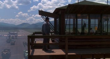 Movie still from “Always” (1989), directed by Steven Spielberg – A man standing on top of a wooden platform; Extreme Wide shot, Low angle