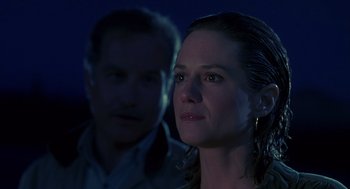Movie still from “Always” (1989), directed by Steven Spielberg – A man and a woman are looking at something; Close Up shot, Over the shoulder angle