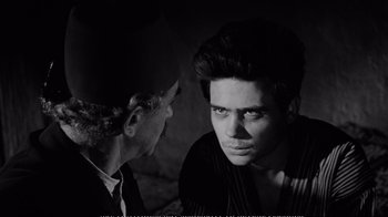 Movie still from “America America” (1963), directed by Elia Kazan – A black and white photo of a man and a man; Close Up shot, Over the shoulder angle